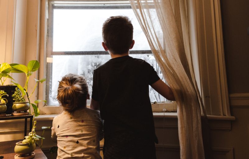 Children looking through the window (1)