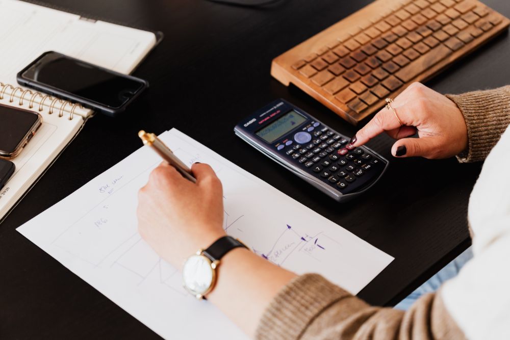 Woman computing using the calculator